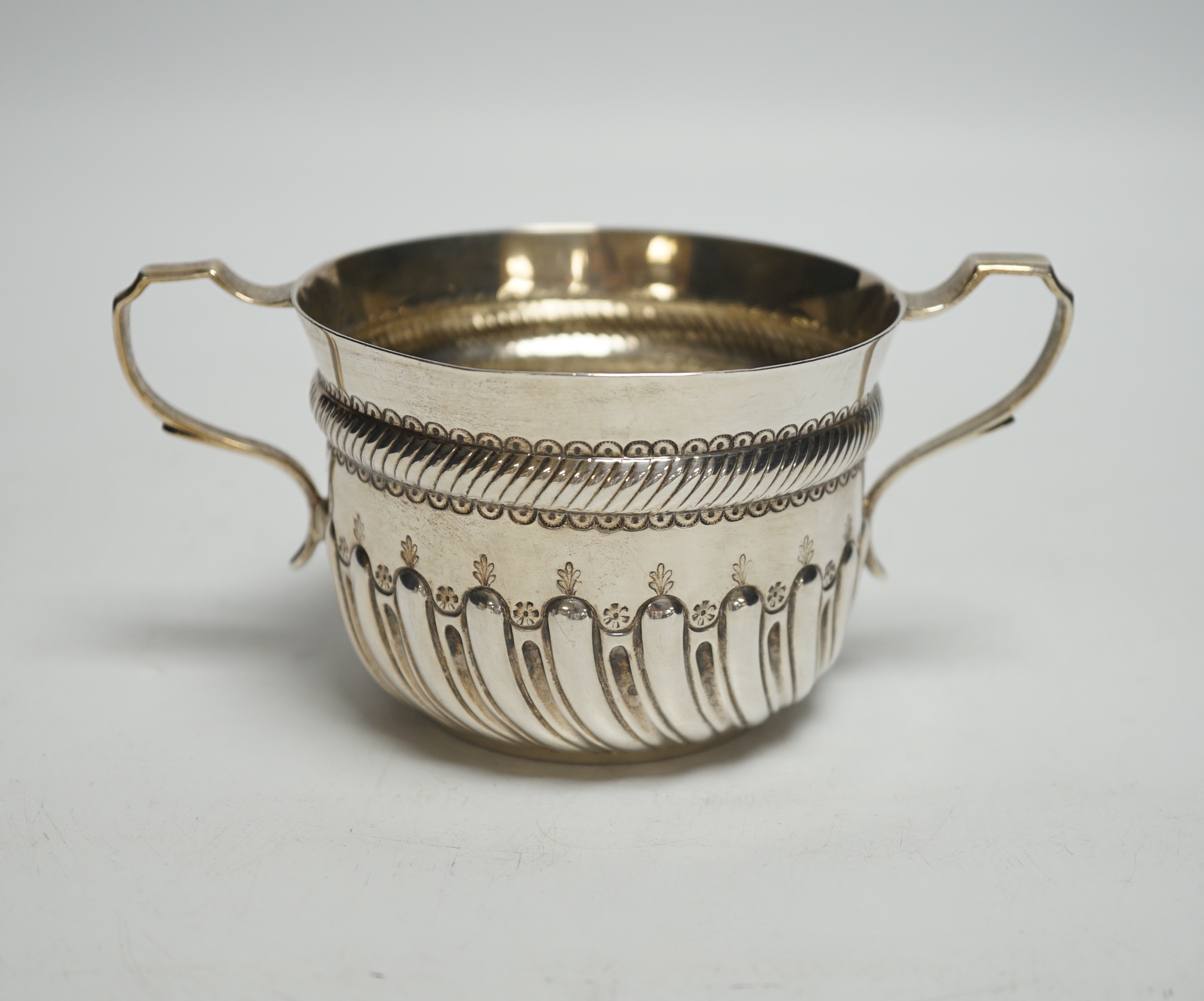 A late Victorian demi fluted silver porringer, John Septimus Beresford, London, 1886, 4.7oz.